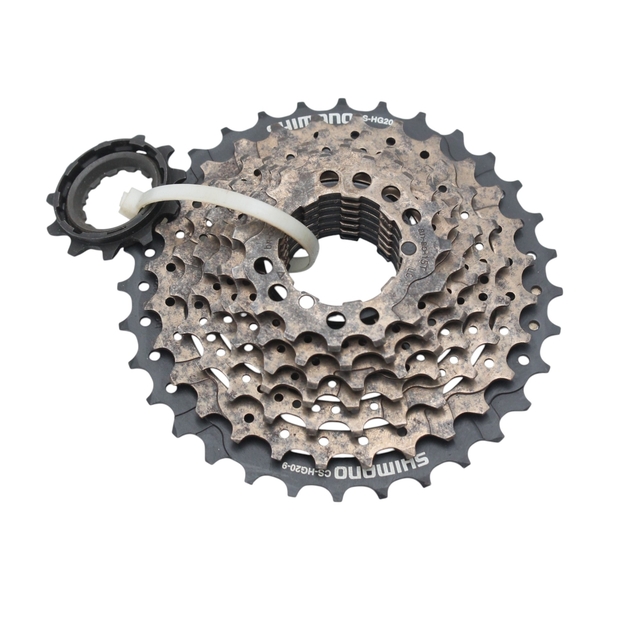 Касета 9 швидкостей SHIMANO (CS-HG20-9), чорно-коричнева (11-32Т) (оцінка (немає зірки 11зубів)) (Singapore) фото westvelo.com